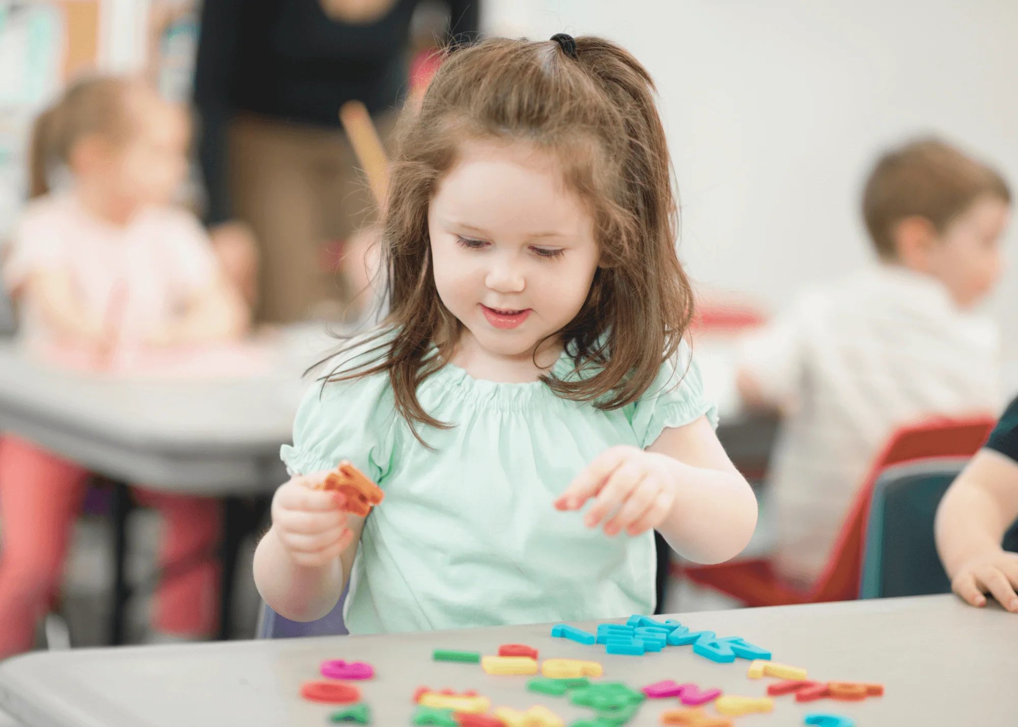 Little girl,Table,Chairs,Plastic letters