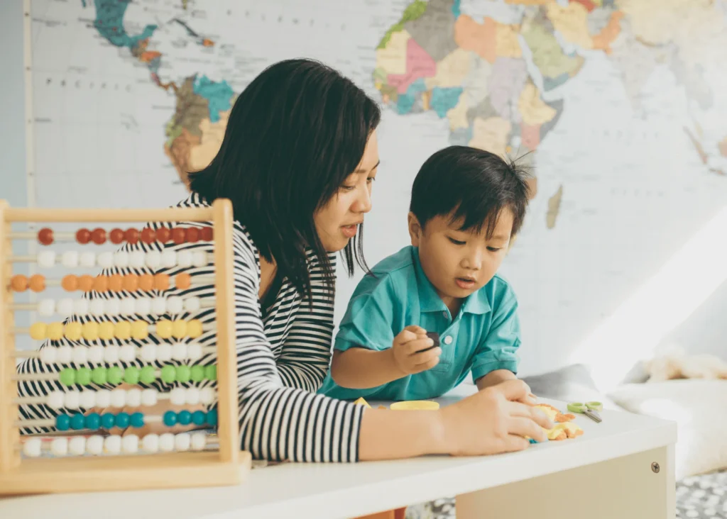 Woman,Child,Toy car,Zebra Toy,Map,Table