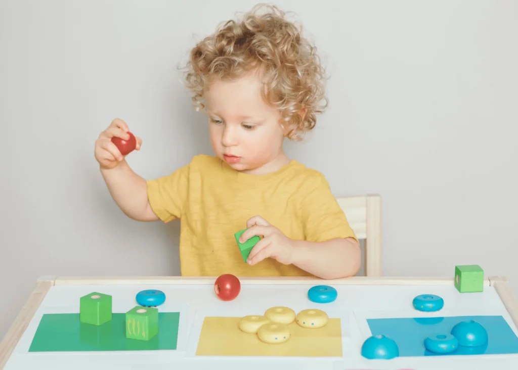 Toy with buttons,Other toys on the table