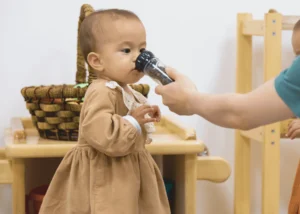 Baby,Bottle,Brown dress,Person,Room